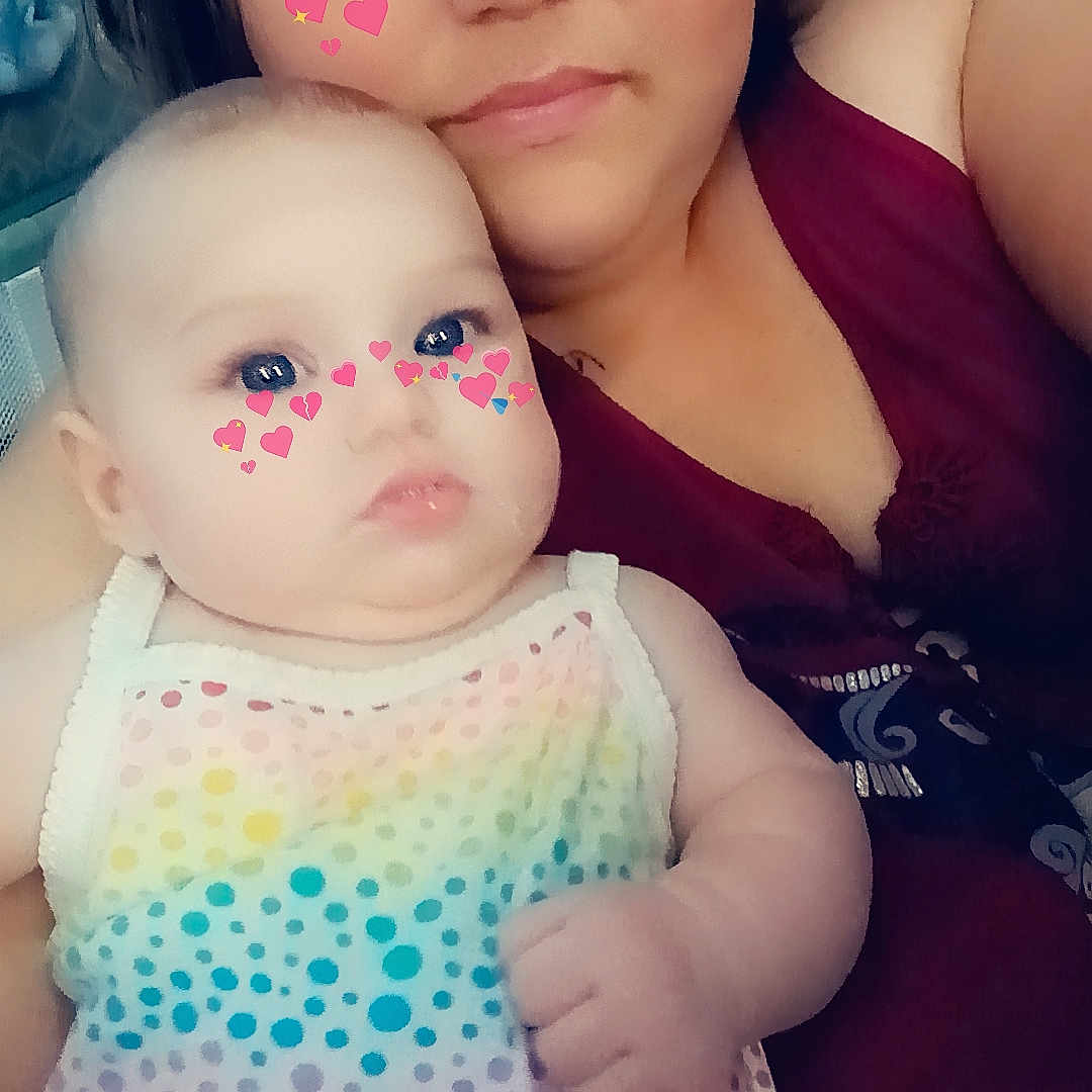 Rowyn is registered to the contest to win money with this photo: applique, baby, bodypart, clothing, dress, face, finger, hand, happy, head, mouth, newborn, pattern, person, photography, polkadot, portrait, selfie, smile, tanktop