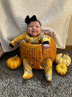 Harper joined the competition — help win amazing prizes! baby, baby_toddler_clothing, calabaza, carving, child, cucurbita, flooring, gourd, happy, headwear, linens, natural_foods, person, pumpkin, room, sitting, smile, squash, toddler, vegetable