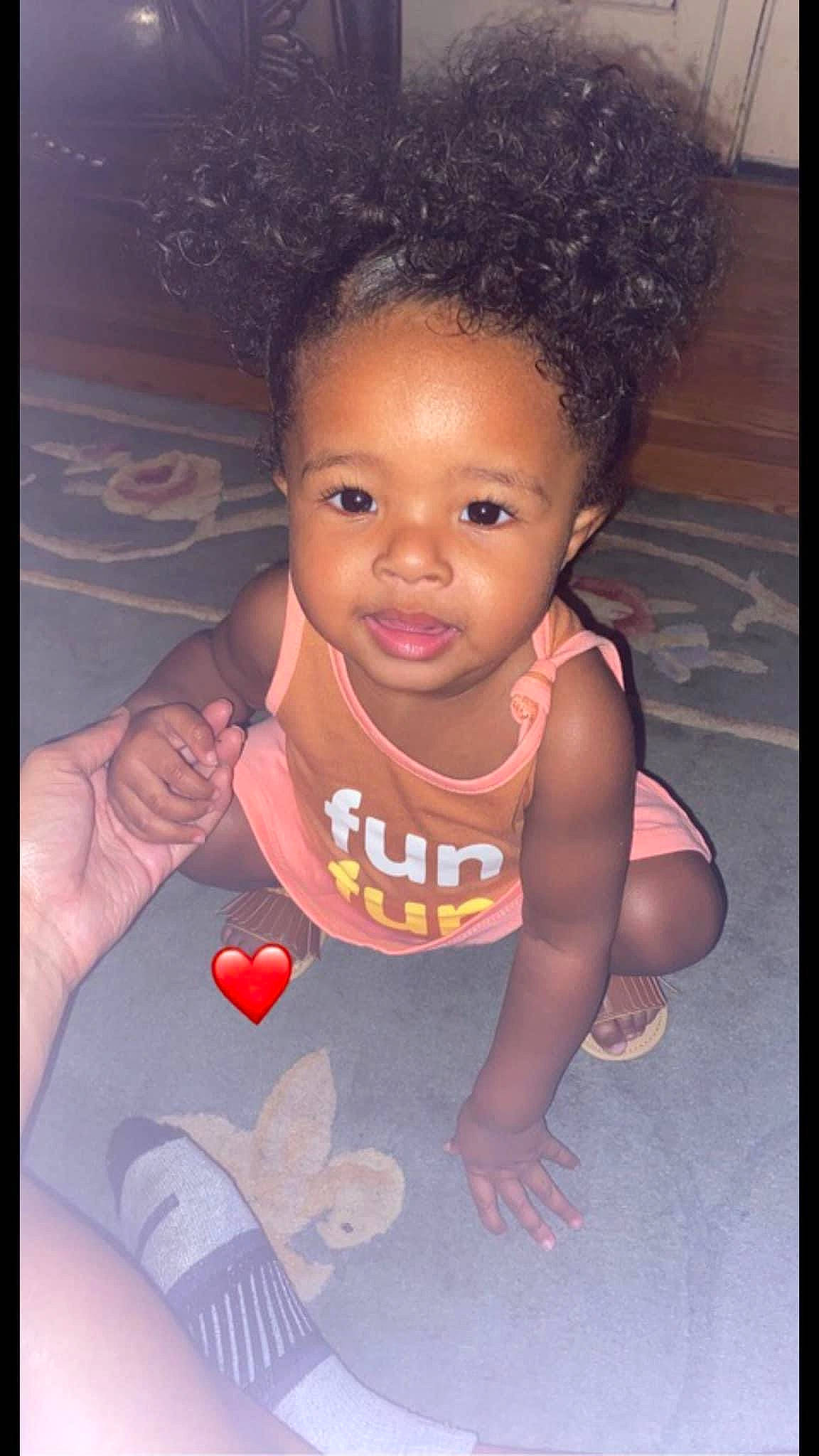 Laylani is registered to the contest to win money with this photo: adaptation, afro, baby_toddler_clothing, cheek, child, cool, eyelash, finger, flash_photography, forehead, gesture, hair, hairstyle, happy, lip, nose, person, pink, skin, smile