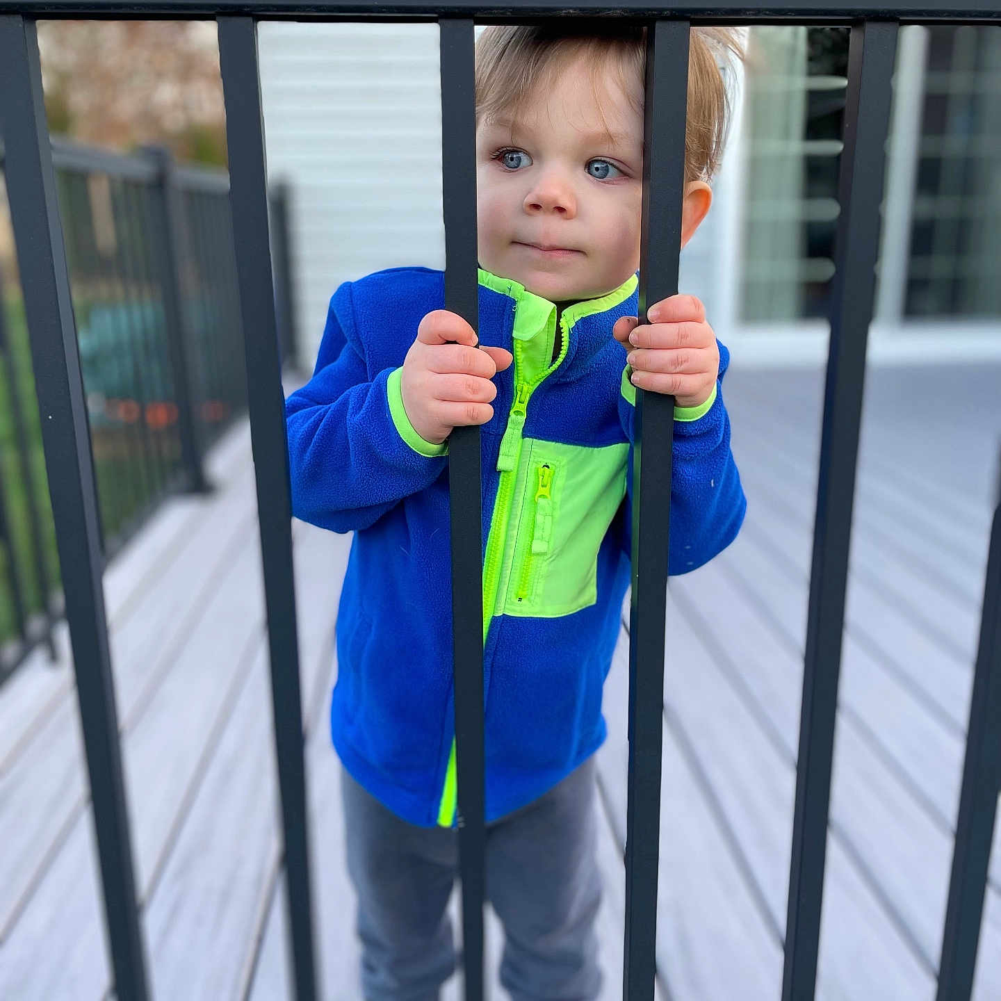 Ethen Dean is registered to the contest to win money with this photo: bodypart, boy, child, clothing, coat, face, finger, footwear, hand, handrail, head, jacket, knitwear, male, pants, person, photography, portrait, railing, shoe