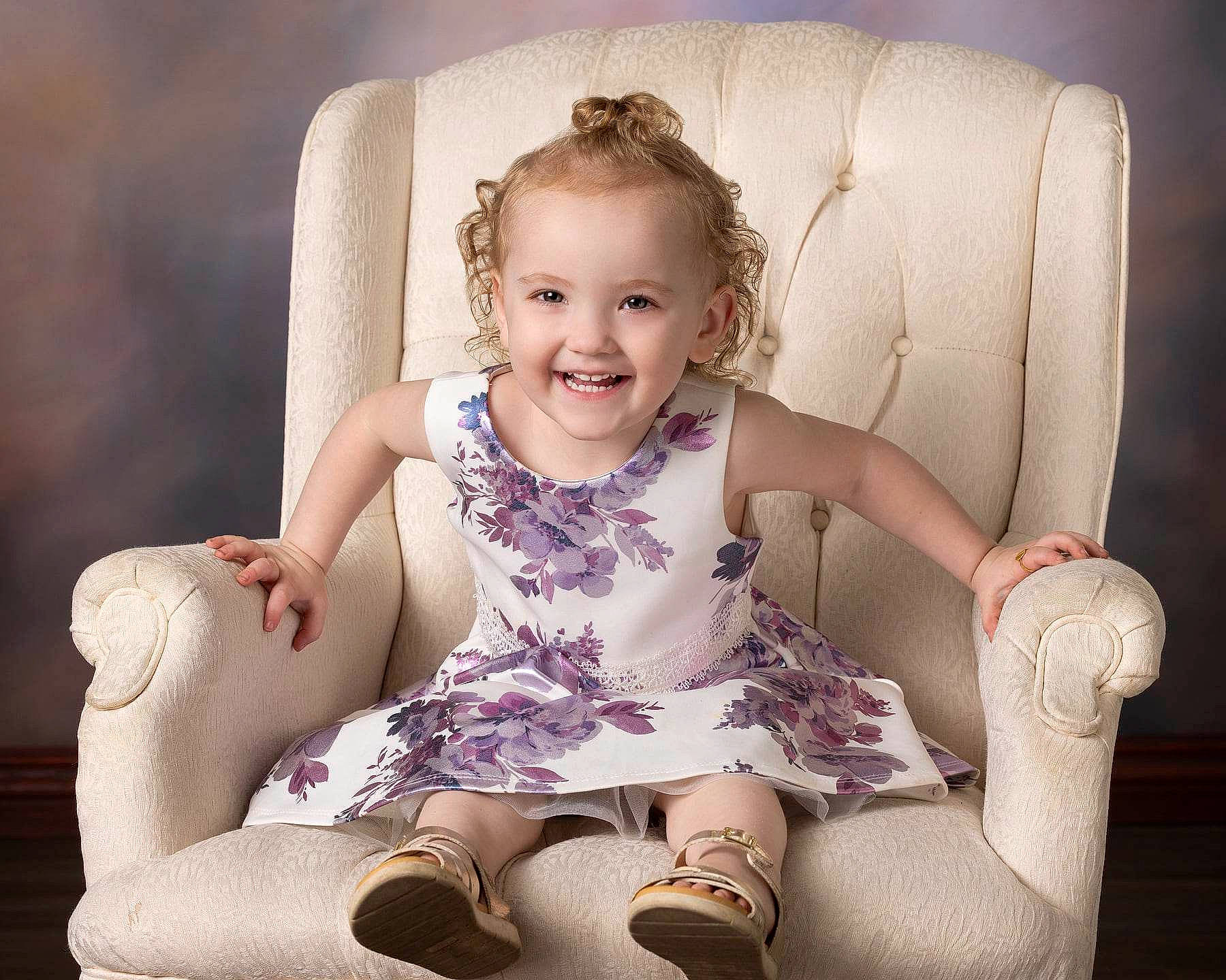 Amelia is registered to the contest to win money with this photo: arm, cheek, comfort, face, flash_photography, hair, hairstyle, head, human_body, iris, joint, joy, leg, neck, person, purple, shoe, shoulder, skin, sleeve