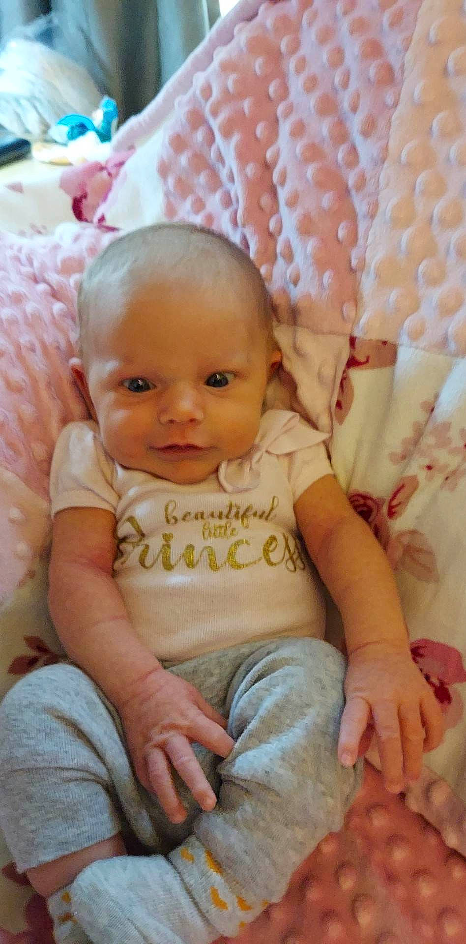 Gabriella joined the competition — help win amazing prizes! baby, baby_toddler_clothing, cheek, child, comfort, event, eye, face, happy, head, iris, nose, pattern, person, pink, skin, sleeve, smile, textile, toddler