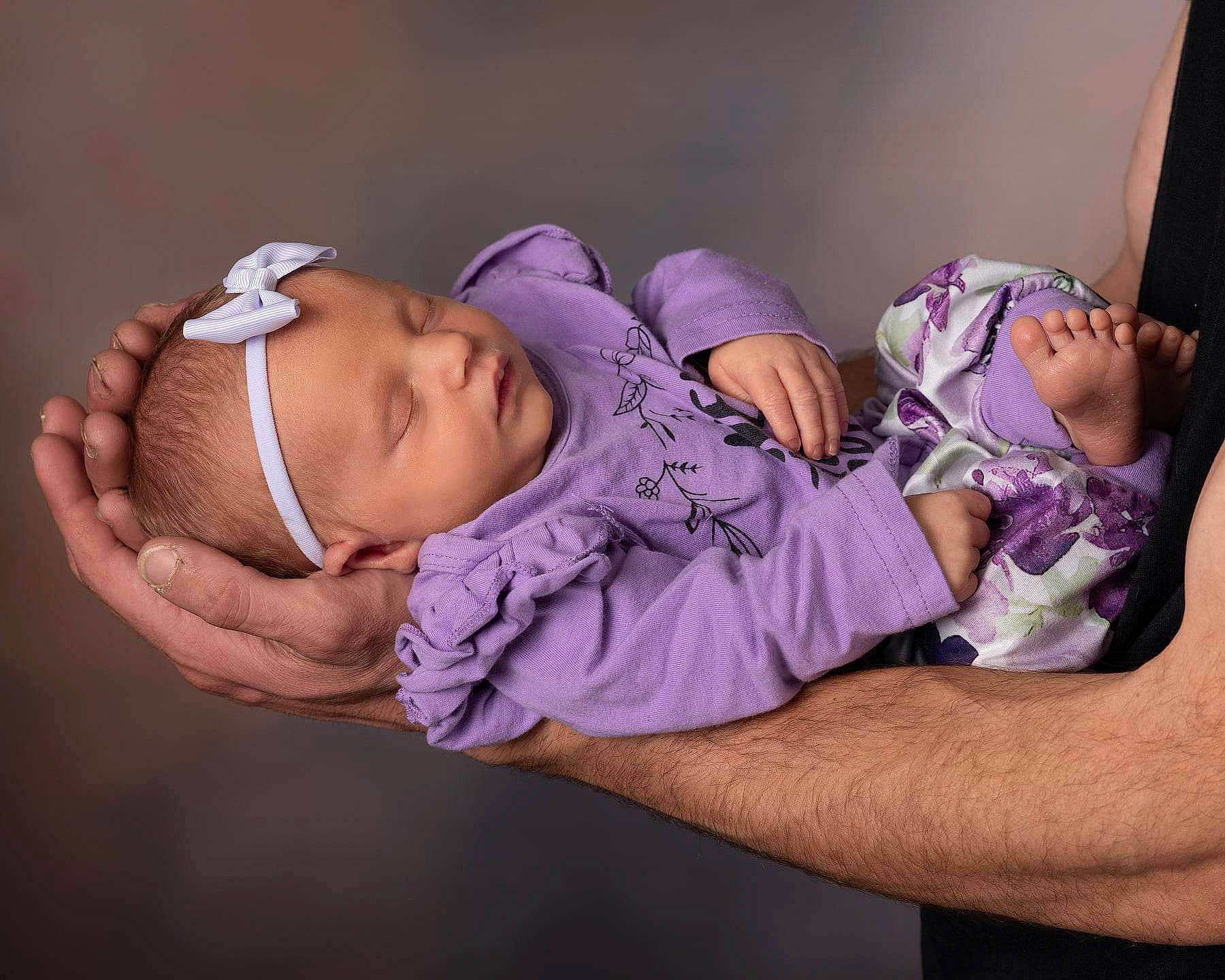 Gabriella is registered to the contest to win money with this photo: arm, baby, baby_sleeping, baby_toddler_clothing, cheek, child, comfort, elbow, face, finger, flash_photography, happy, hat, headgear, headwear, human_body, mouth, muscle, person, purple