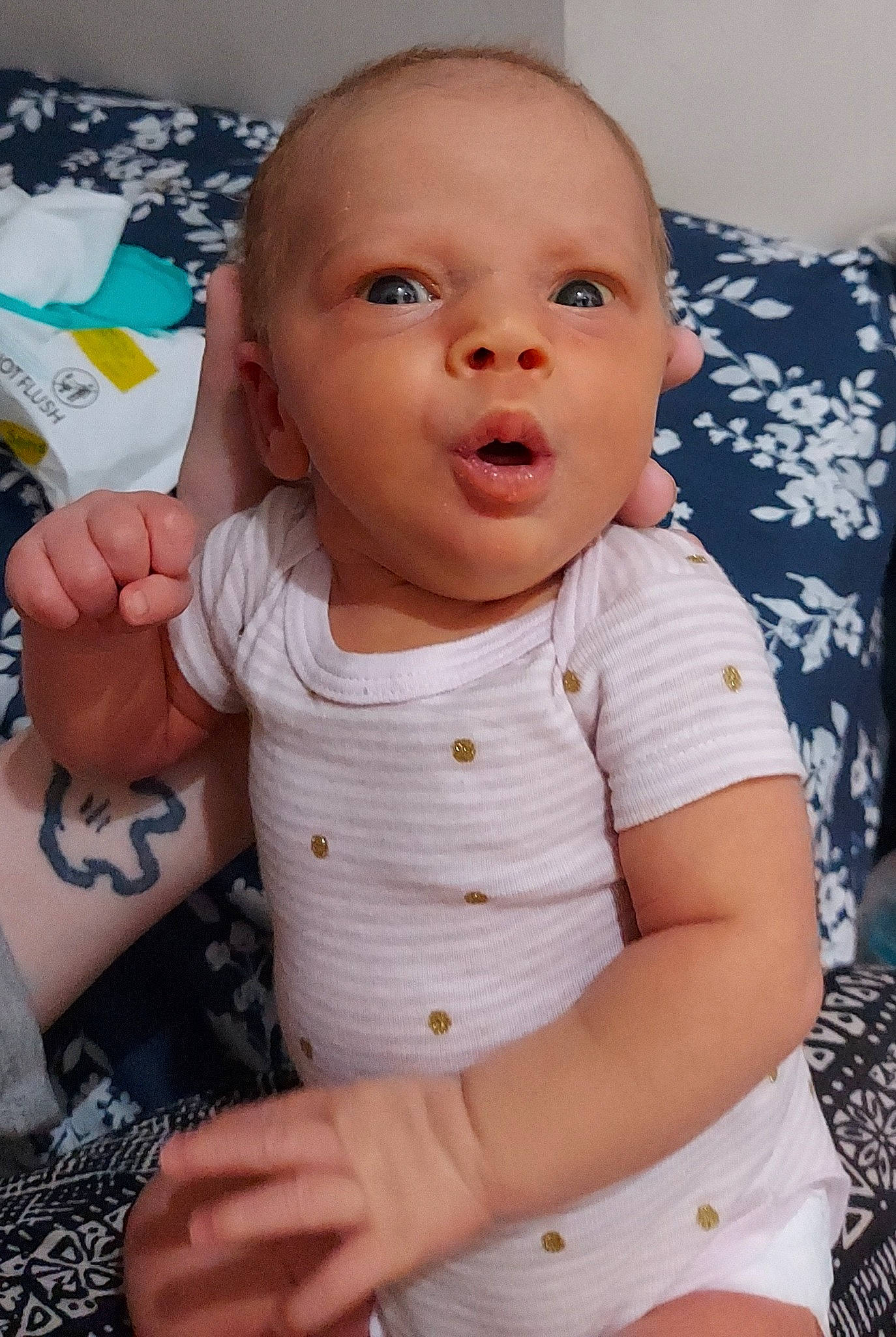 Gabriella is registered to the contest to win money with this photo: baby, baby_toddler_clothing, cheek, comfort, eye, gesture, hairstyle, happy, head, human_body, iris, lip, mouth, neck, nose, person, product, skin, sleeve, stomach