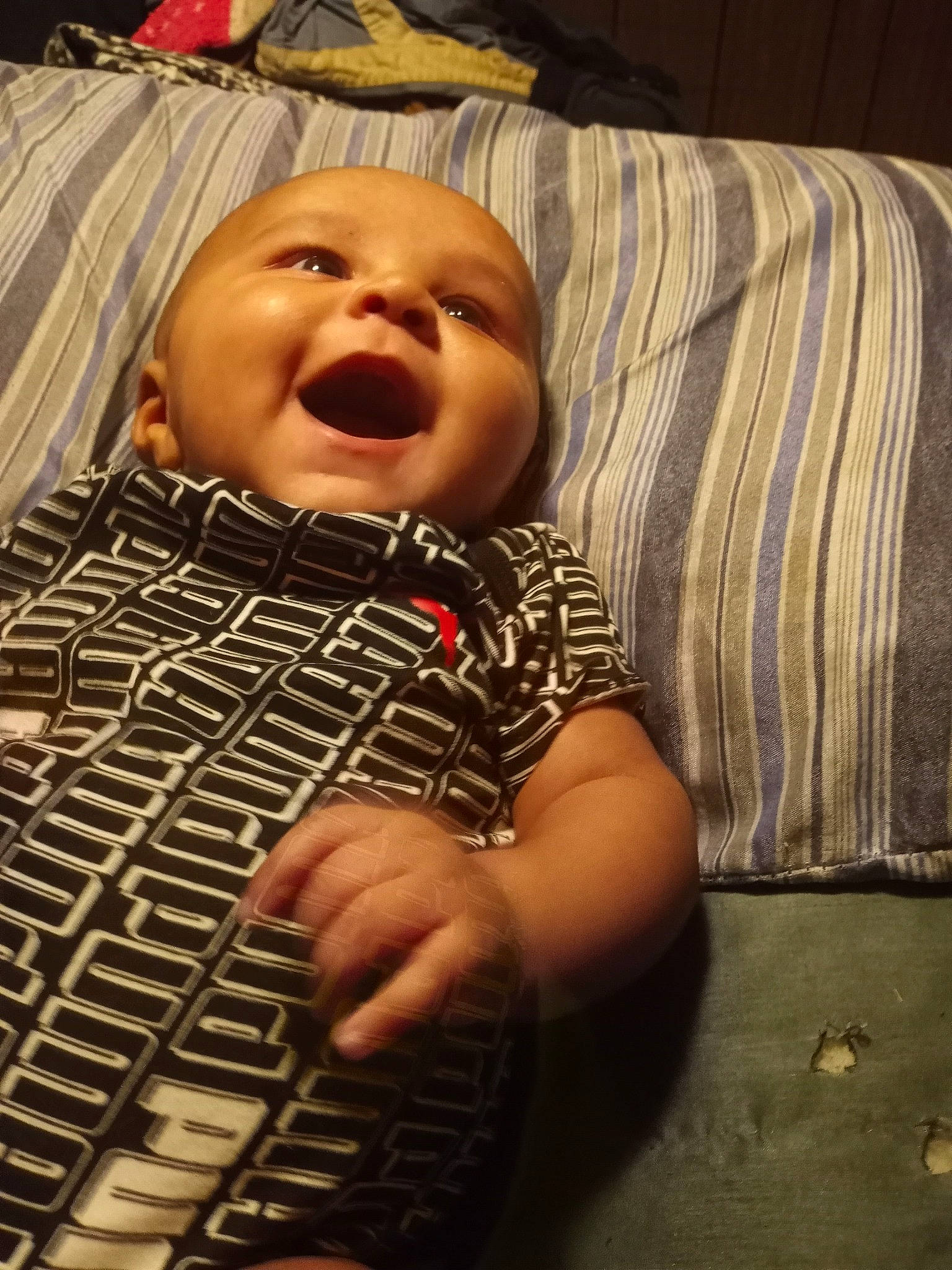 Miikkel is registered to the contest to win money with this photo: baby, baby_laughing, baby_toddler_clothing, cheek, child, comfort, eye, flash_photography, flooring, grass, happy, head, nose, pattern, person, photograph, sitting, skin, smile, toddler