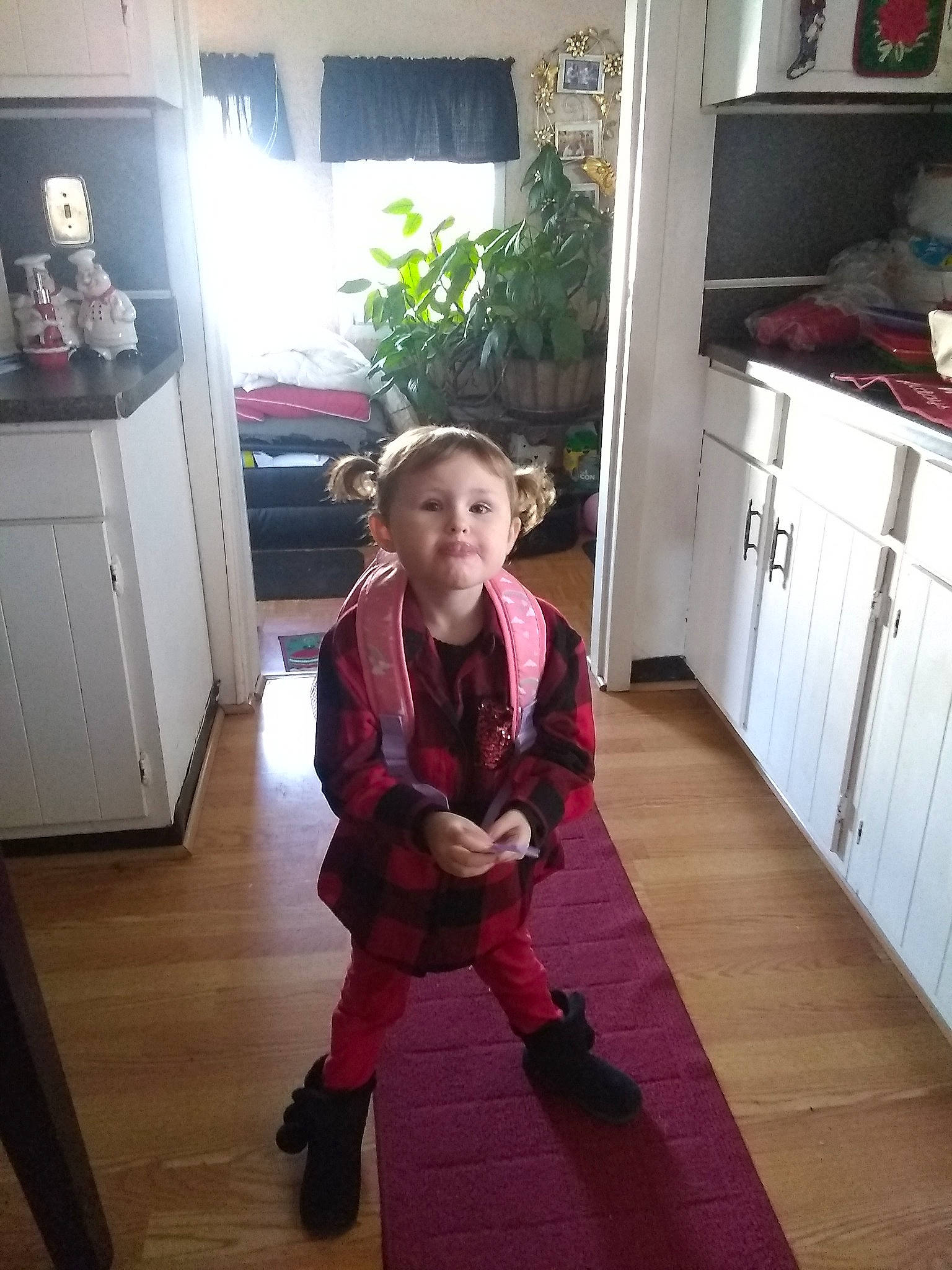 Savana is registered to the contest to win money with this photo: child, clothing, costume, day, floor, flooring, fun, girl, house, outerwear, person, product, room, shoulder, snapshot, standing, toddler