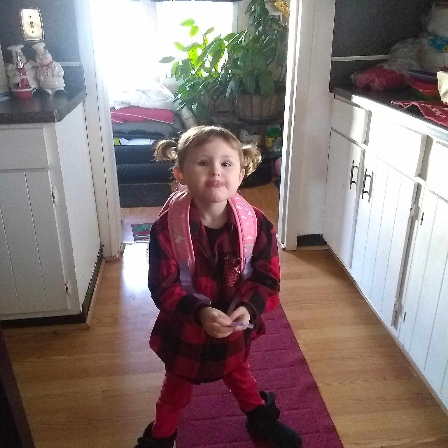 Savana is registered to the contest to win money with this photo: child, clothing, costume, day, floor, flooring, fun, girl, house, outerwear, person, product, room, shoulder, snapshot, standing, toddler