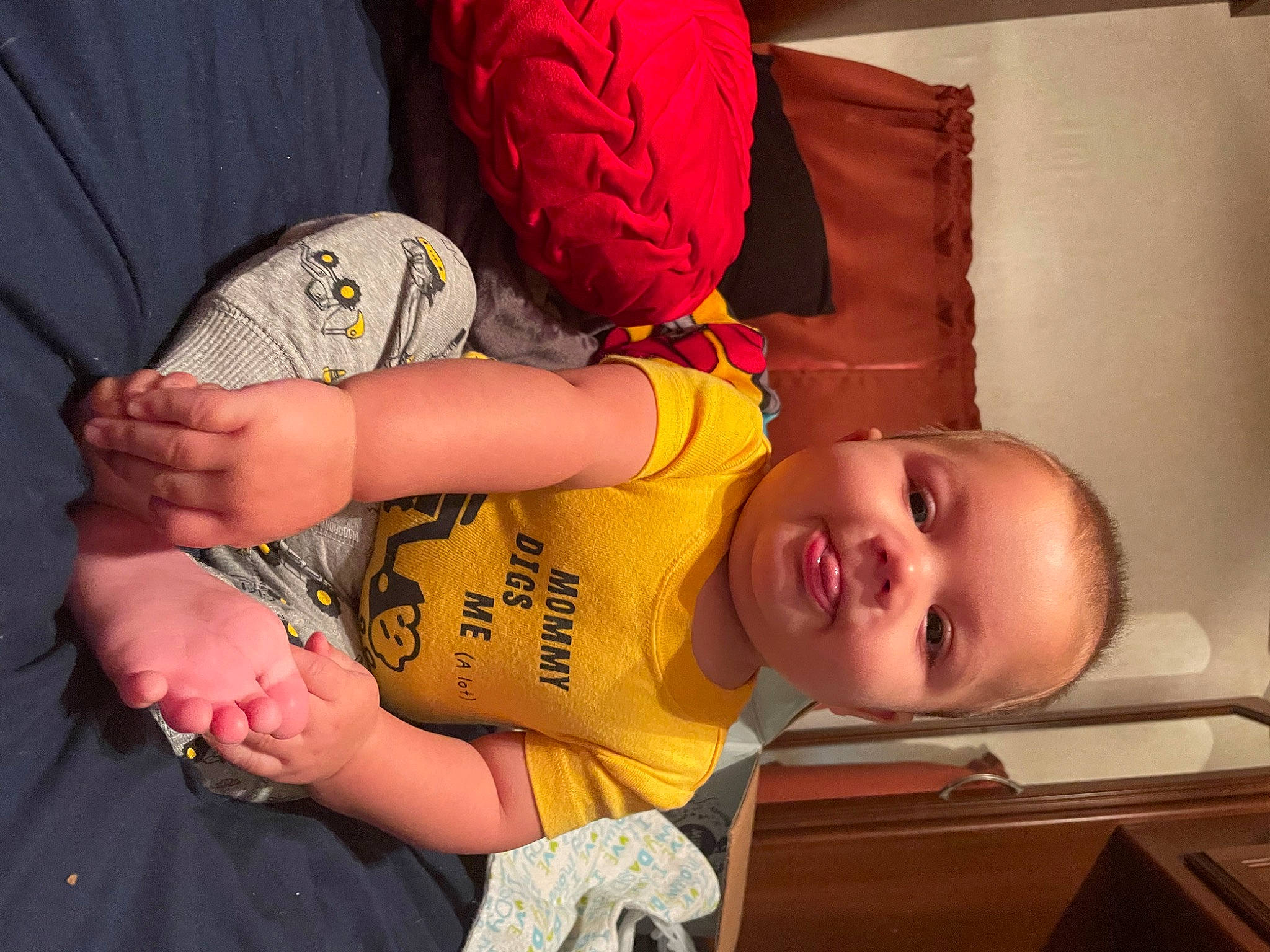 Oliver is registered to the contest to win money with this photo: arm, baby, baby_toddler_clothing, cheek, child, comfort, elbow, eye, finger, hand, happy, joint, mouth, muscle, nose, person, skin, smile, t_shirt, toddler