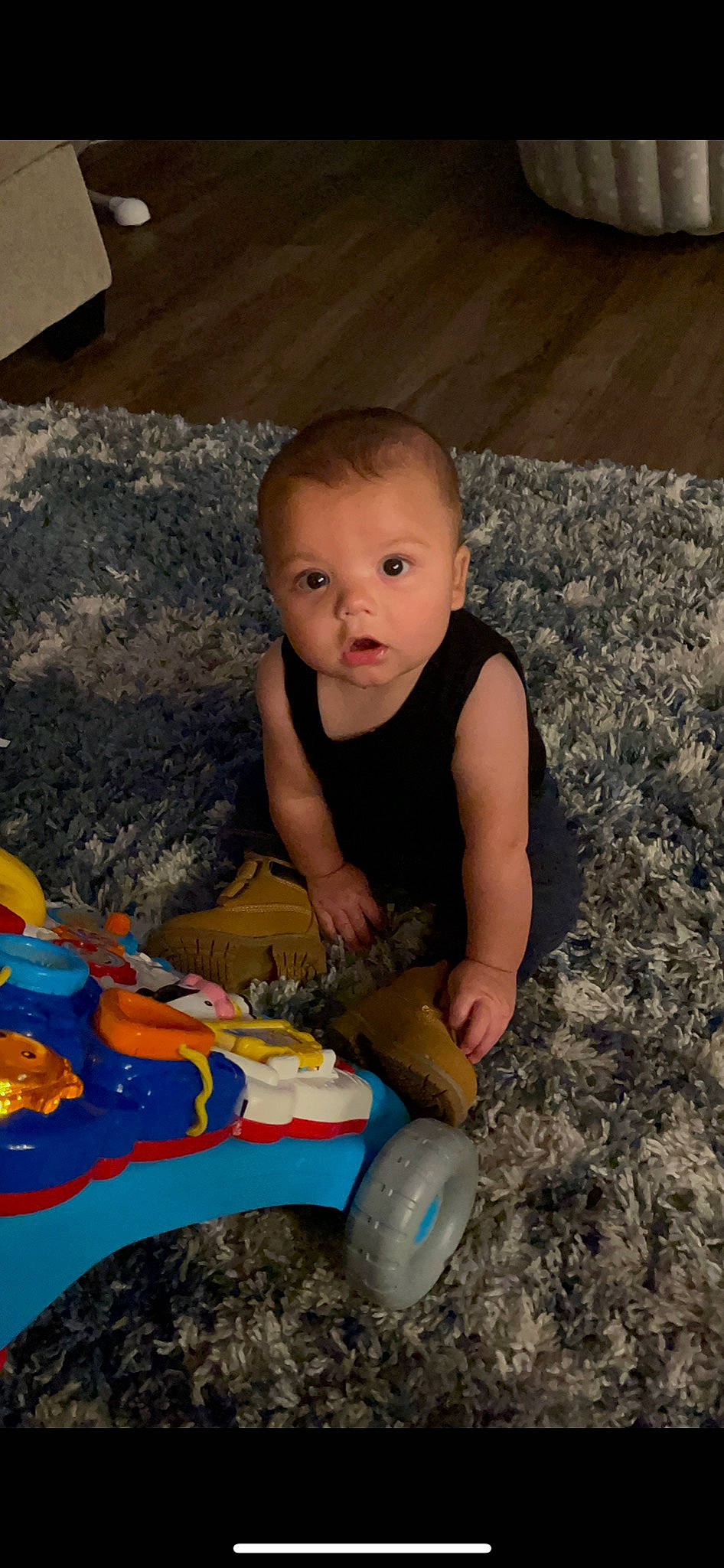 Oliver is registered to the contest to win money with this photo: baby, baby_playing_with_toys, baby_toddler_clothing, cheek, child, flooring, foot, fun, happy, head, human_body, iris, mouth, people, person, product, sitting, t_shirt, toddler, toy