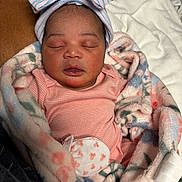 Khalia joined the competition — help win amazing prizes! newborn, baby, sleeping, blanket, bow_hat, pink_clothing, infant, cute, soft_texture, wrapped, peaceful, child, portrait, indoor, resting, cozy, warm, headwear, small_hands, closeup