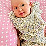 Elise a rejoint le concours — aidez-le/la à gagner de superbes lots ! baby, child, closeup, clothing, cushion, cute, face, floral, hand, indoors, infant, person, pink, polka_dot, portrait, ruffles, sitting, skin, smile, young