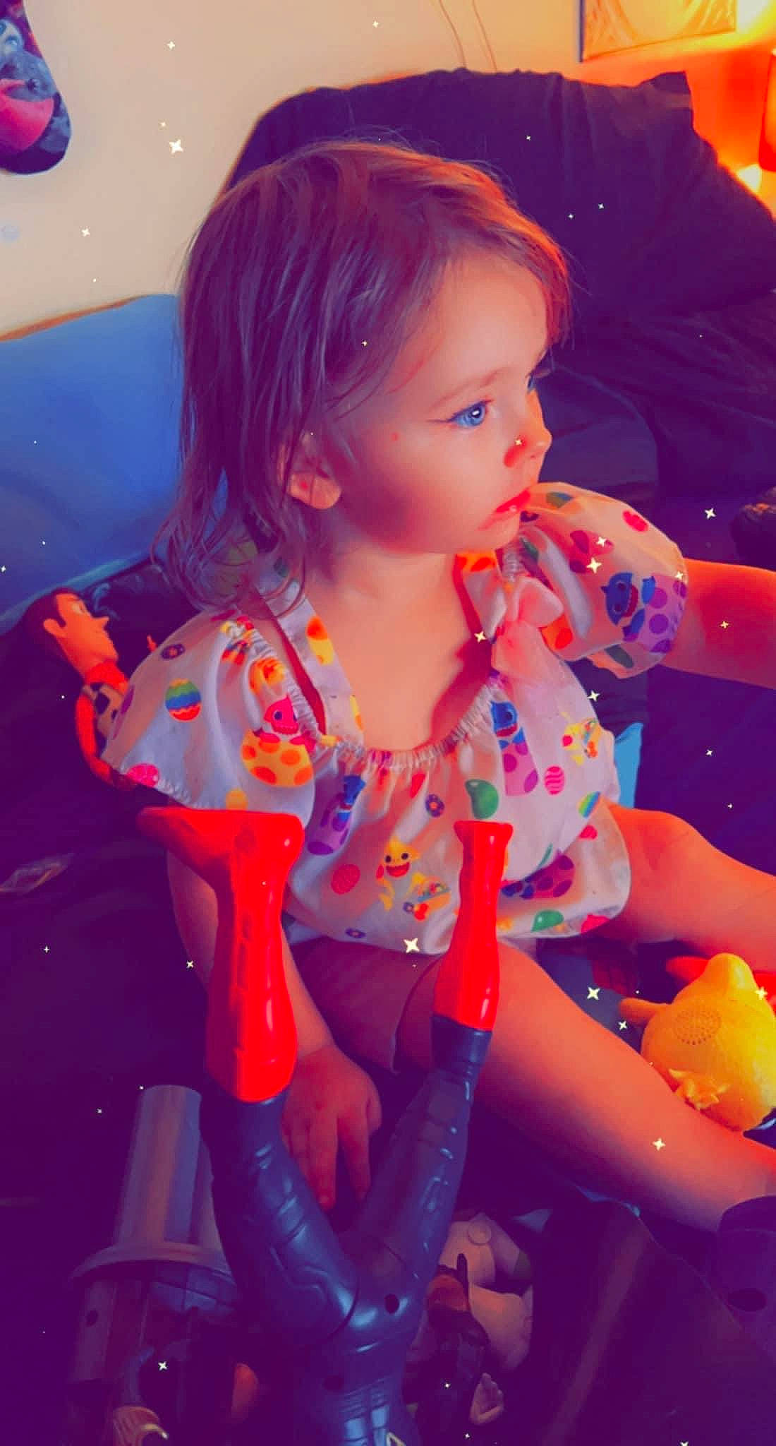 Malia joined the competition — help win amazing prizes! baby_toddler_clothing, blond, brown_hair, child, dress, electric_blue, fun, happy, human_body, human_leg, leisure, lip, magenta, pattern, person, pink, purple, sitting, skin, thigh