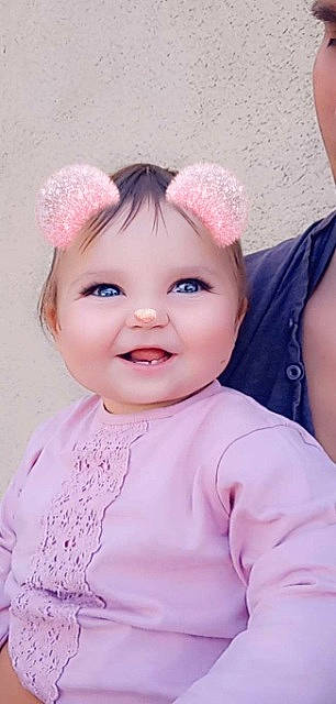 Anna-livia participe au concours pour gagner de l'argent avec cette photo : baby, baby_toddler_clothing, cap, cheek, eyebrow, eyelash, happy, head, headwear, iris, joy, lip, magenta, neck, nose, person, photograph, pink, purple, skin