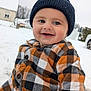 baby, child, smiling, hat, plaid_shirt, outdoor, snow, winter, cold_weather, happy, face, person, clothing, headwear, seasonal, nature, daylight, cute, portrait, warm_clothing