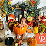 baby, pumpkin, fall, autumn, scarecrow, decoration, holiday, cute, child, orange, yellow, green, plant, festive, indoors, smiling, seasonal, harvest, toy, floor
