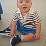 toddler, child, sitting, floor, striped_shirt, blue_shorts, sneakers, nike, sock, indoor, tile_floor, cute, happy, baby, portrait, casual_clothing, one_person, young_child, looking_at_camera, short_hair