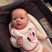 Monica joined the competition — help win amazing prizes! baby, infant, bib, owl, onesie, seat, cushion, indoor, clothing, cute, face, hand, pink, white, expression, person, portrait, child, newborn, comfort