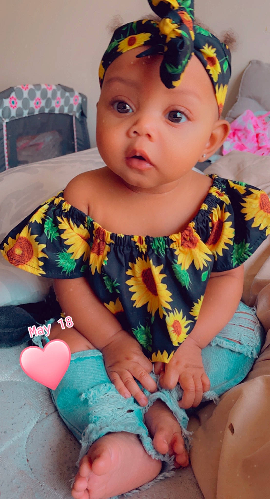 Ari is registered to the contest to win money with this photo: baby_toddler_clothing, blue, cheek, chin, dress, eye, face, facial_expression, green, headwear, iris, lip, mouth, neck, organ, person, photograph, pink, purple, skin