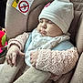 baby, car_seat, sleeping, hat, knitted_sweater, child, infant, soft_fabric, car_interior, seat_belt, cute, peaceful, napping, face, hand, clothing, comfort, child_safety, transportation, car