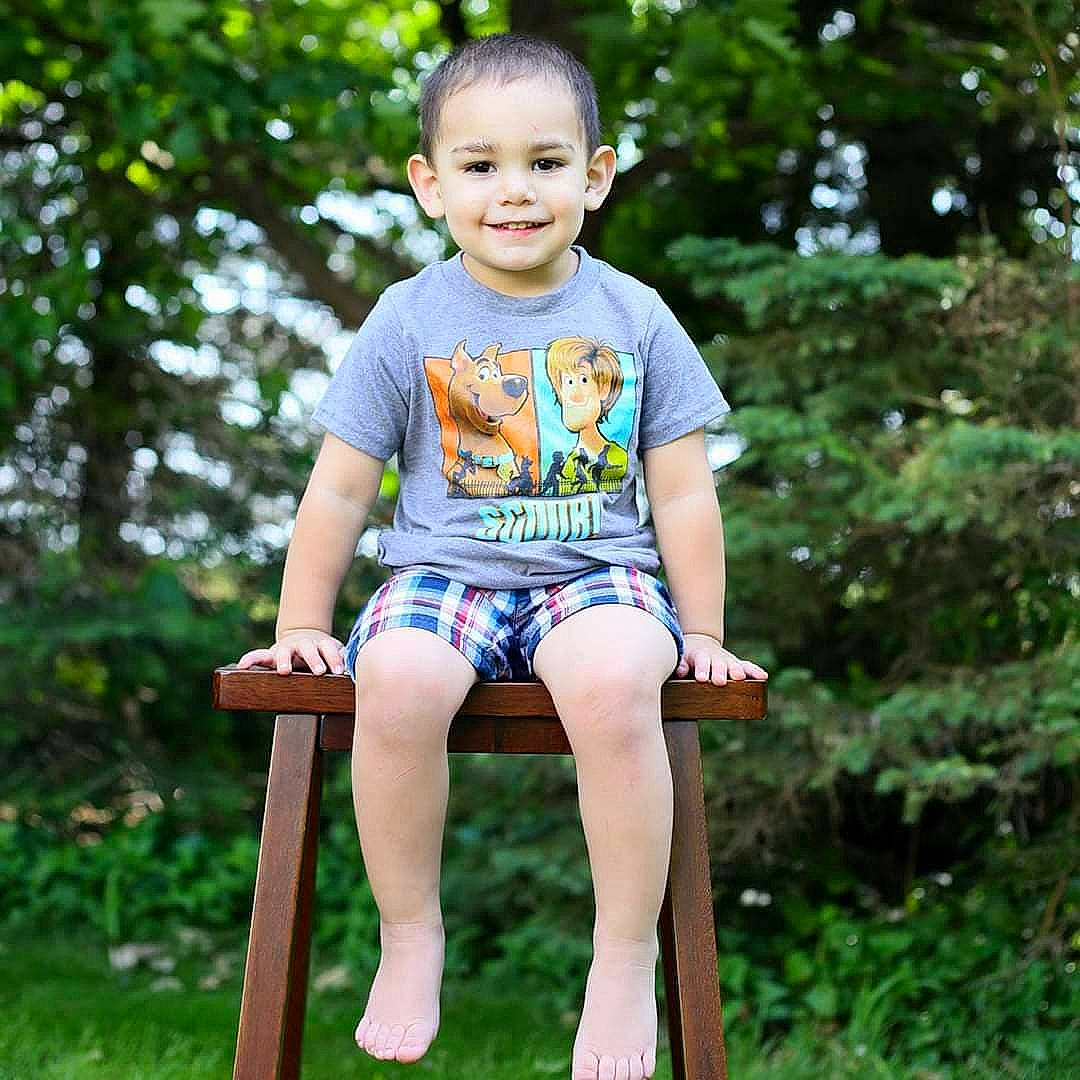 Dominic is registered to the contest to win money with this photo: baby_toddler_clothing, child, child_model, furniture, joy, pattern, person, shorts, sitting, summer, toddler