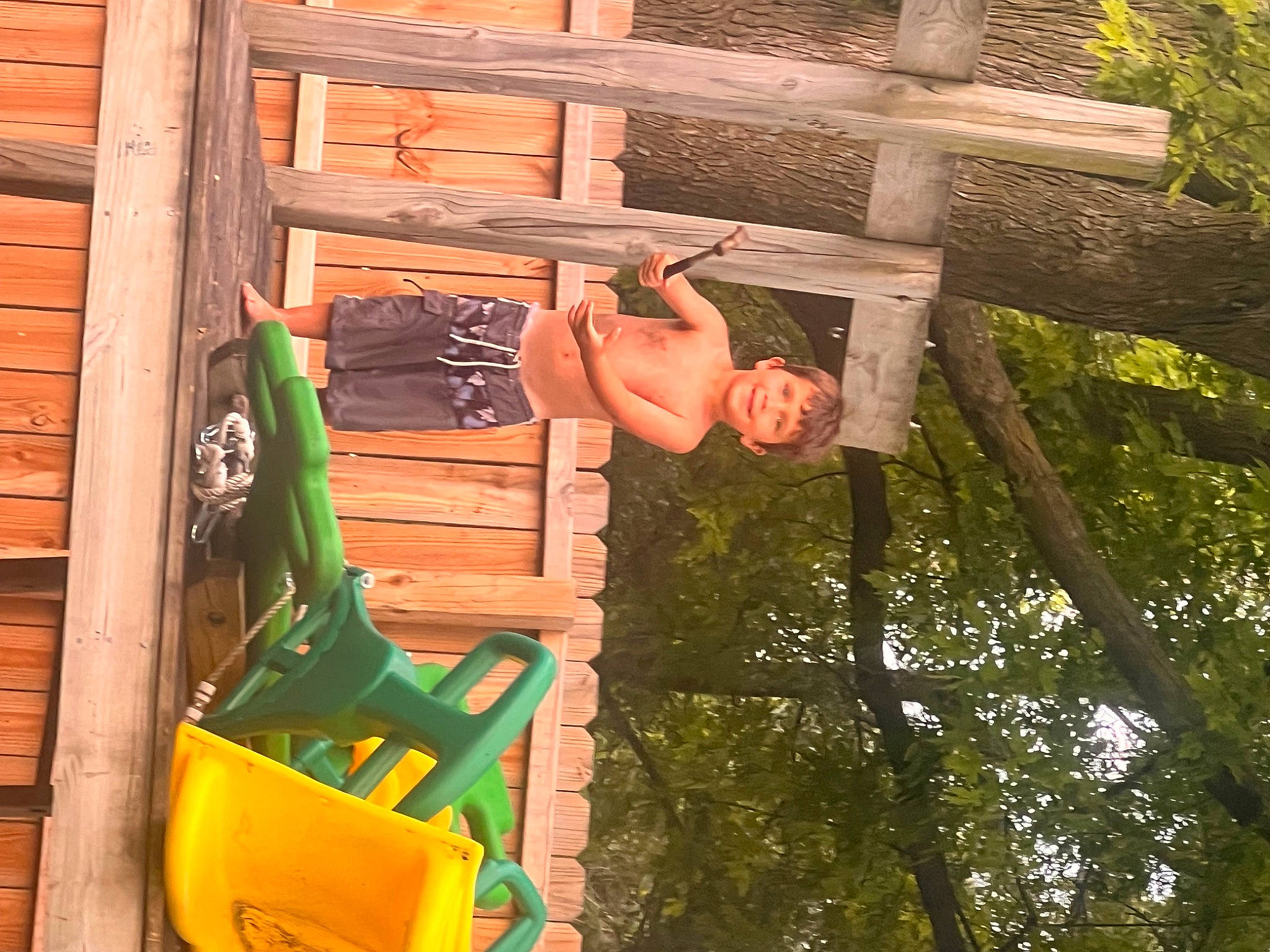 Romeo is registered to the contest to win money with this photo: backyard, child, chute, cross, fun, grass, happy, hardwood, joy, leisure, lumber, nature, outdoor_play_equipment, people_in_nature, person, recreation, symbol, toddler, tree, vacation