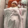 newborn, baby, hospital, crib, bassinet, blanket, pink, hat, sleeping, plush_toy, bunny, soft, cozy, infant, child, resting, indoor, medical, cute, peaceful