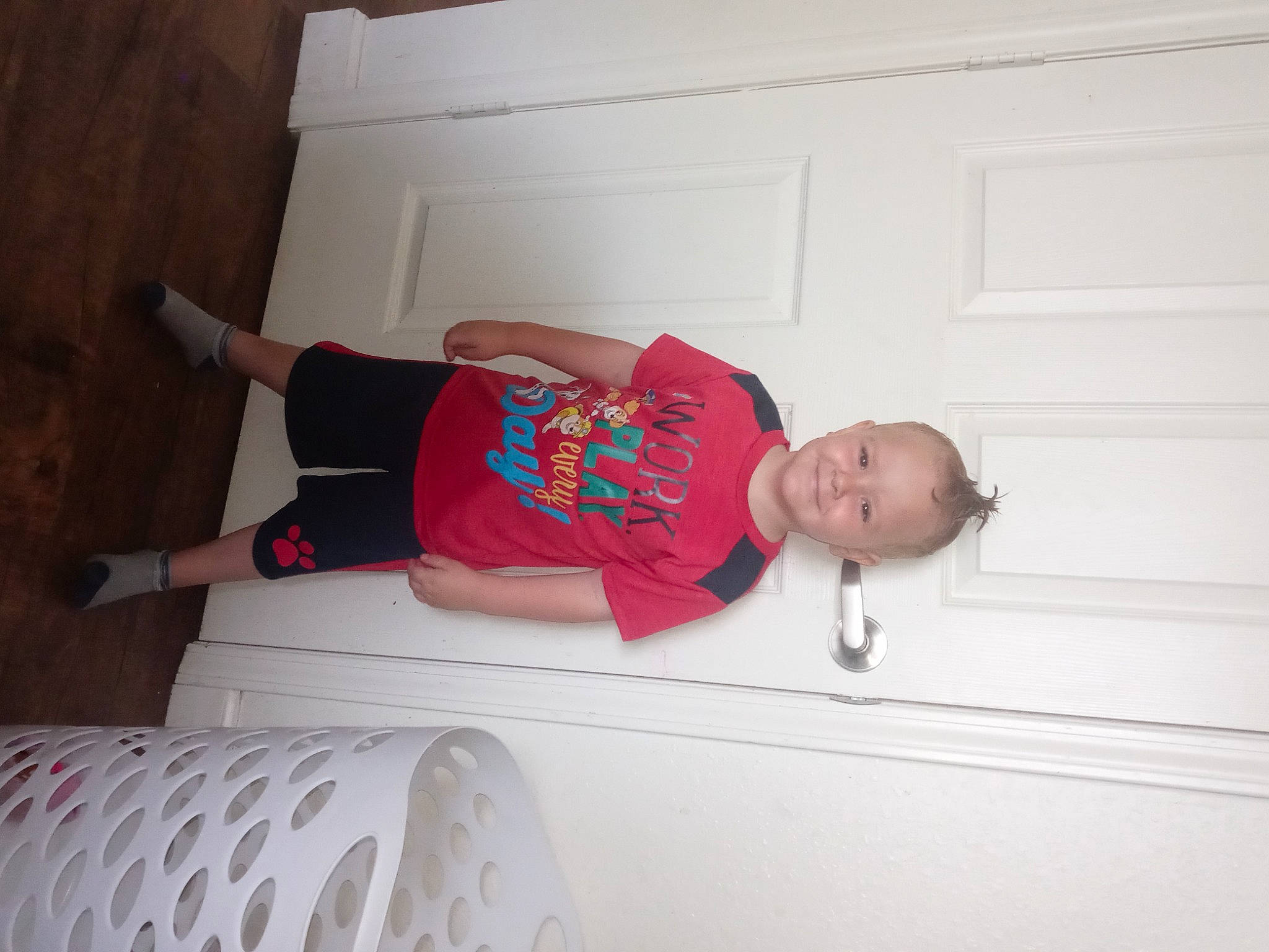 Jeffrey is registered to the contest to win money with this photo: baby_toddler_clothing, child, comfort, elbow, flooring, fun, hardwood, hat, human_leg, joy, knee, leg, person, room, shorts, sleeve, sock, sportswear, t_shirt, thigh