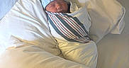 Amari is registered to the contest to win money with this photo: baby, bed, blanket, blue_hat, child, cozy, cute, hospital_blanket, indoors, infant, newborn, peaceful, pillow, portrait, resting, sleeping, soft_light, swaddled, white_bedding, wrapped