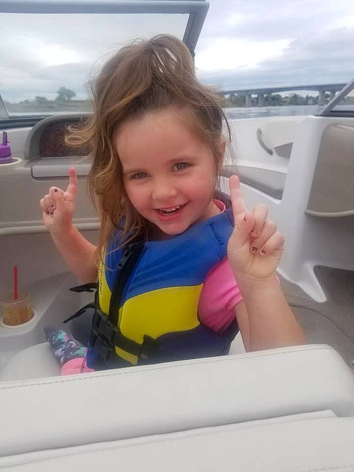 Izabelle is registered to the contest to win money with this photo: boating, car, child, finger, fun, hand, joy, leisure, person, personal_protective_equipment, play, recreation, skin, smile, summer, thumb, toddler, vacation, vehicle