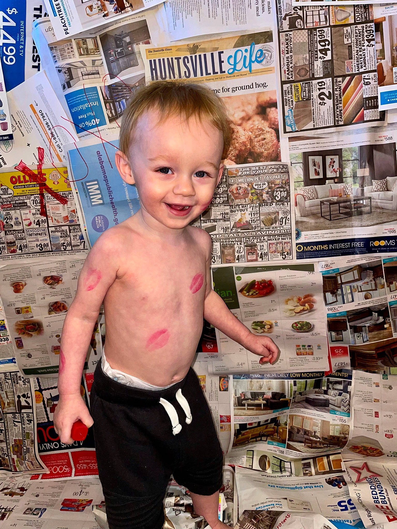 Hendrix is registered to the contest to win money with this photo: advertising, baby, barechested, chest, child, fun, happy, joy, magazine, newspaper, paper_product, pattern, person, photograph, publication, recreation, smile, t_shirt, toddler, visual_arts