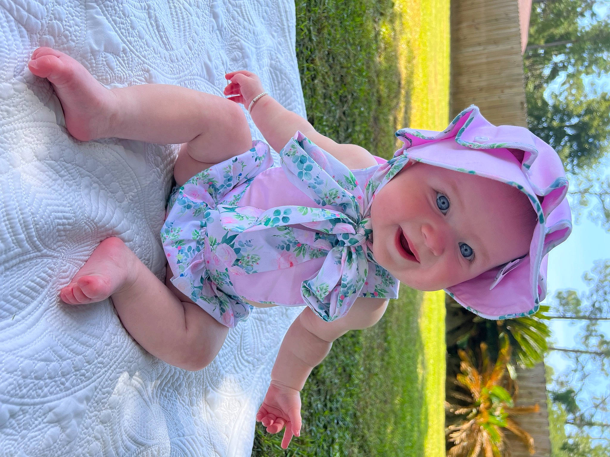 Katie joined the competition — help win amazing prizes! baby_laughing, baby_toddler_clothing, child, fun, grass, happy, hat, headwear, leisure, magenta, people_in_nature, person, pink, plant, play, purple, recreation, skin, smile, sun_hat