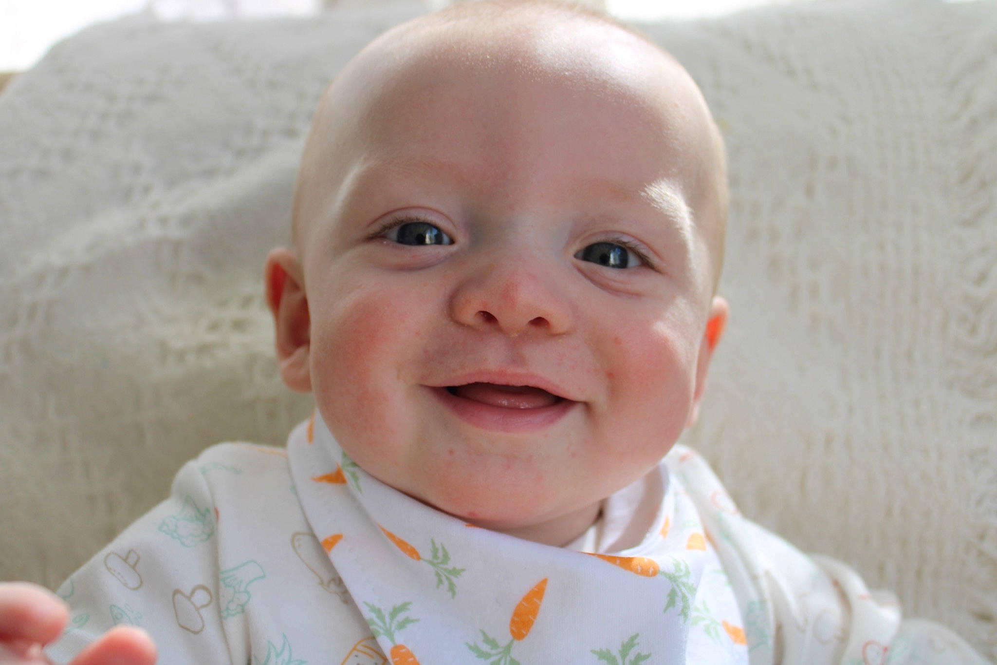 Fisher is registered to the contest to win money with this photo: baby, baby_laughing, baby_toddler_clothing, cheek, child, collar, dress, finger, fun, gesture, happy, iris, joy, lip, nose, person, photograph, skin, sleeve, smile