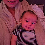 Gabriel joined the competition — help win amazing prizes! baby, child, sibling, striped_onesie, towel, indoor, portrait, happy, smiling, cozy, family, young, cute, face, person, skin, head, clothing, blanket, relaxing