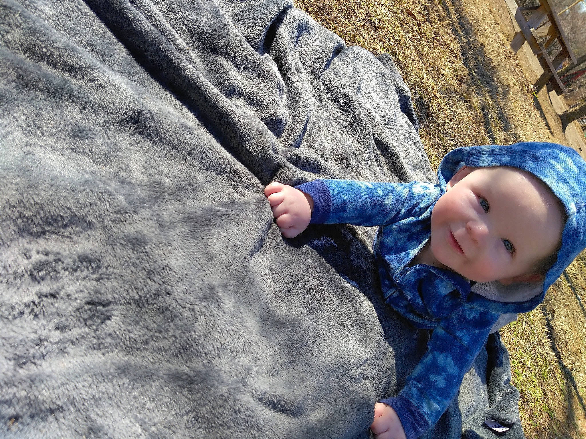Malachi is registered to the contest to win money with this photo: azure, baby, beauty, blue, child, denim, electric_blue, eye, freezing, grass, headwear, leisure, outerwear, pattern, person, sand, skin, soil, toddler, tree