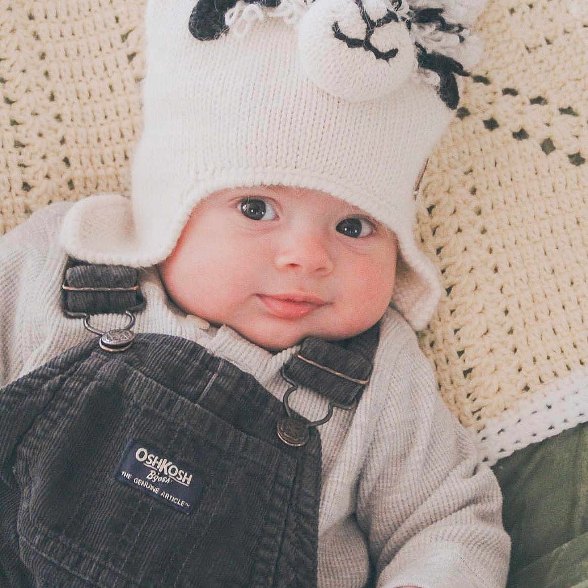 Onyx joined the competition — help win amazing prizes! baby, baseballcap, beanie, bonnet, cap, clothing, coat, couch, face, furniture, glove, hat, head, jacket, jeans, newborn, pants, person, photography, portrait