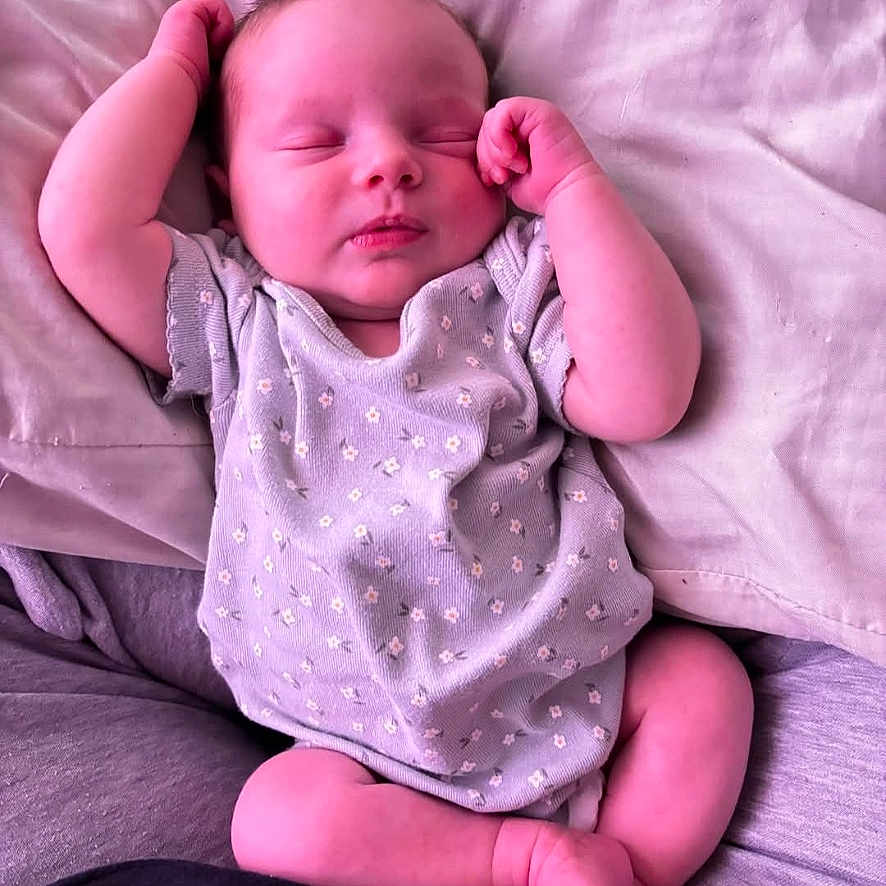 Chevelle is registered to the contest to win money with this photo: architecture, baby, bed, bedroom, blanket, bodypart, cushion, face, finger, furniture, hand, head, homedecor, indoors, newborn, person, photography, portrait, room, sleeping