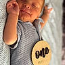 Colter joined the competition — help win amazing prizes! baby, infant, newborn, sleeping, one_month, milestone, wooden_sign, gray_clothing, blanket, soft_texture, cute, peaceful, hand, portrait, lying_down, close_up, skin, child, indoors, cozy