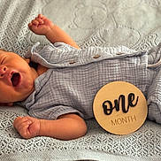 Colter joined the competition — help win amazing prizes! baby, newborn, infant, yawning, blanket, blue_clothing, wooden_sign, one_month, sleepy, cute, lying_down, soft_texture, knitted_blanket, child, portrait, indoors, peaceful, small_hands, buttoned_clothing, resting