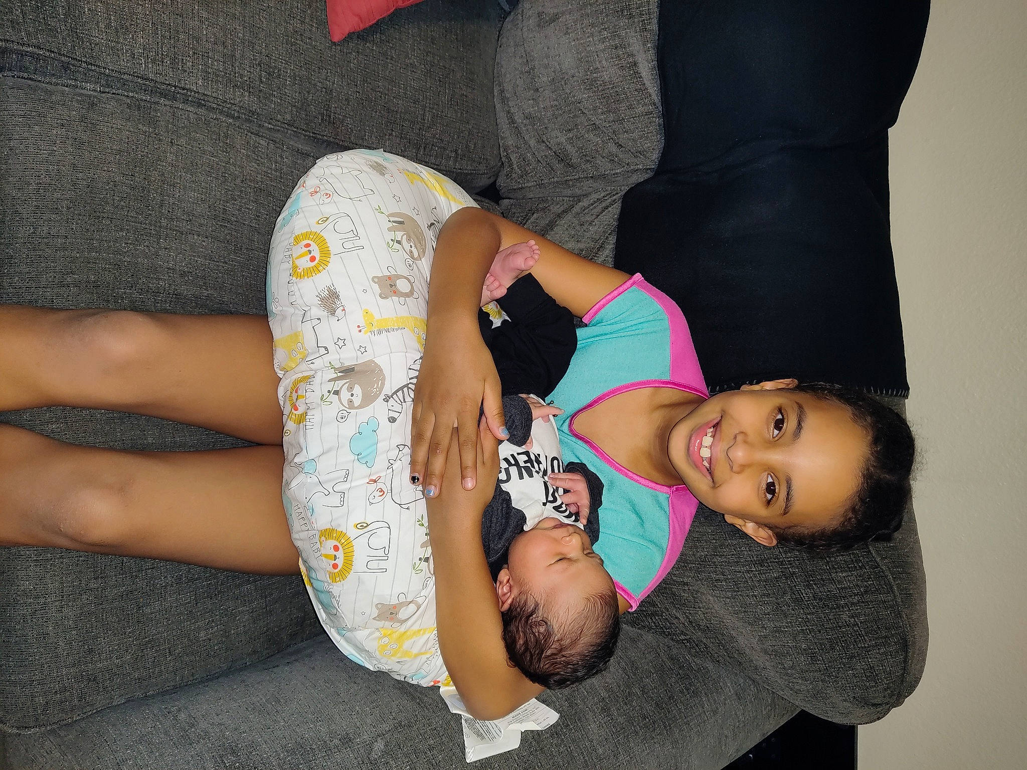 Zariah joined the competition — help win amazing prizes! abdomen, arm, baby_toddler_clothing, black_hair, chest, comfort, elbow, finger, gesture, happy, headgear, joint, joy, knee, neck, person, sleeve, smile, stomach, t_shirt