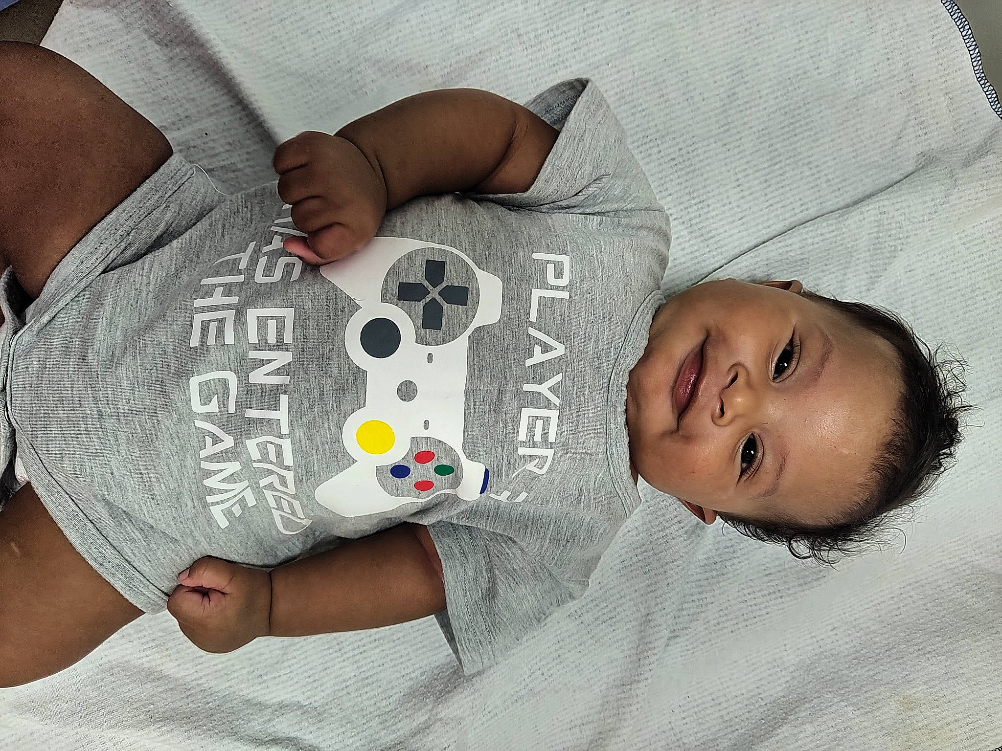 Deondre is registered to the contest to win money with this photo: baby, baby_products, baby_sleeping, baby_toddler_clothing, chest, child, comfort, elbow, font, gesture, happy, joy, linens, nail, person, product, skin, sleeve, t_shirt, thigh
