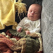 Cameron is registered to the contest to win money with this photo: baby, bed, bedroom, blanket, couch, cushion, face, furniture, head, homedecor, indoors, linen, newborn, person, photography, pillow, portrait, quilt, room, sleeping