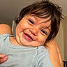 Sebastian is registered to the contest to win money with this photo: baby, child, smiling, face, hair, person, indoor, shirt, blue_shirt, closeup, happy, cute, infant, skin, portrait, expression, hand, arm, toddler, casual