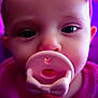 baby, pacifier, face, headband, purple, close_up, child, infant, cute, eyes, mouth, pink, clothing, portrait, person, skin, young_child, baby_girl, indoors, head
