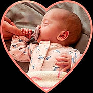 Marley joined the competition — help win amazing prizes! baby, sleeping, pacifier, hand, finger, onesie, pink_clothing, blue_prints, blanket, heart_frame, infant, cute, peaceful, closeup, skin, head, ear, bed, soft, nap