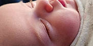Marley joined the competition — help win amazing prizes! baby, sleeping, blanket, closeup, face, infant, peaceful, resting, soft, skin, eyelashes, nose, mouth, indoors, furniture, wood, portrait, child, cozy, calm