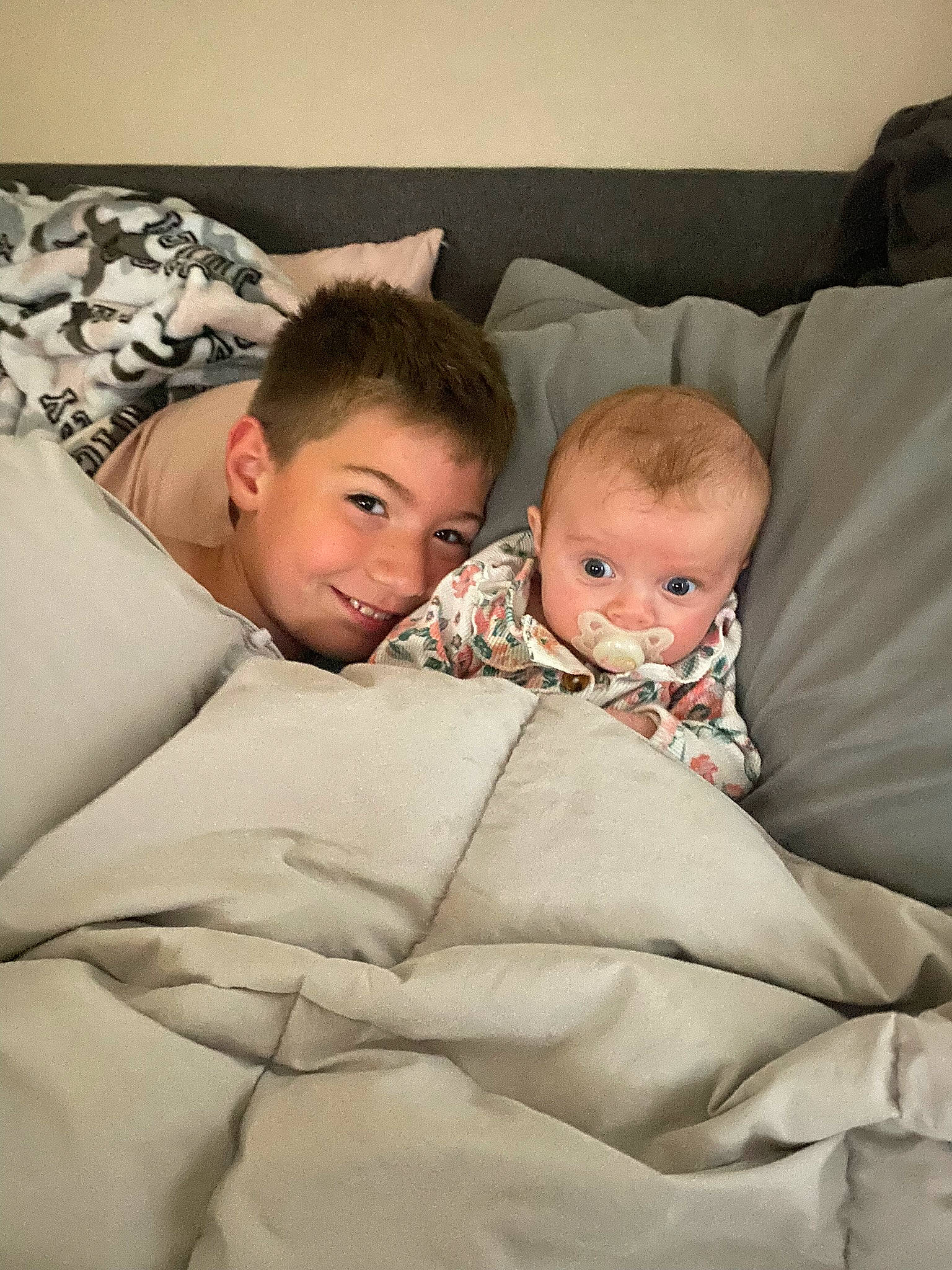 Charlee joined the competition — help win amazing prizes! baby, bedding, child, comfort, couch, event, fun, fur, hair, hairstyle, happy, joy, lap, leg, linens, living_room, person, pillow, room, sitting