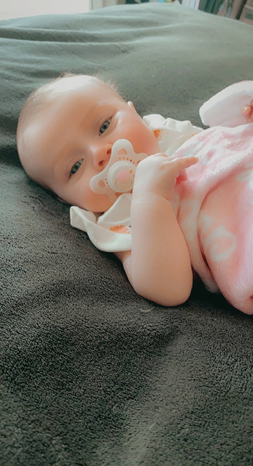 Charlee is registered to the contest to win money with this photo: baby, baby_toddler_clothing, cheek, child, chin, comfort, eye, face, flooring, foot, gesture, head, human_leg, lip, nail, person, skin, thumb, toddler, toe
