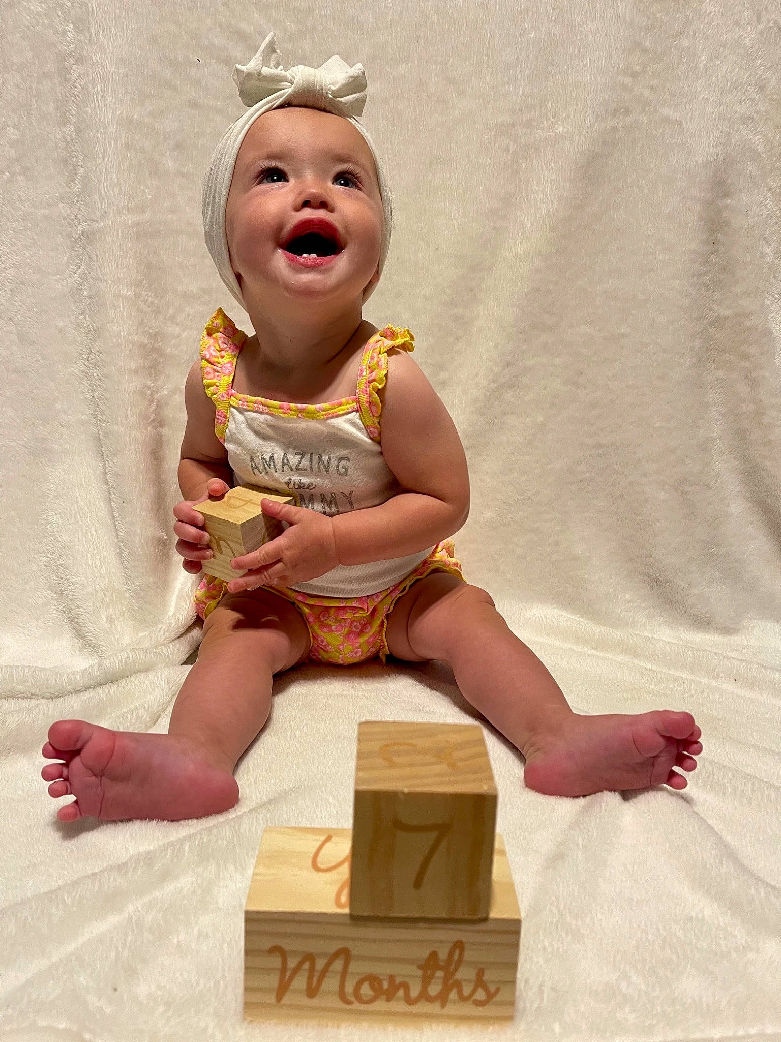 Harleigh joined the competition — help win amazing prizes! baby, baby_laughing, baby_toddler_clothing, barefoot, box, cardboard, carton, child, finger, foot, happy, headwear, human_leg, packaging_and_labeling, packing_materials, person, shipping_box, shorts, sitting, sleeve
