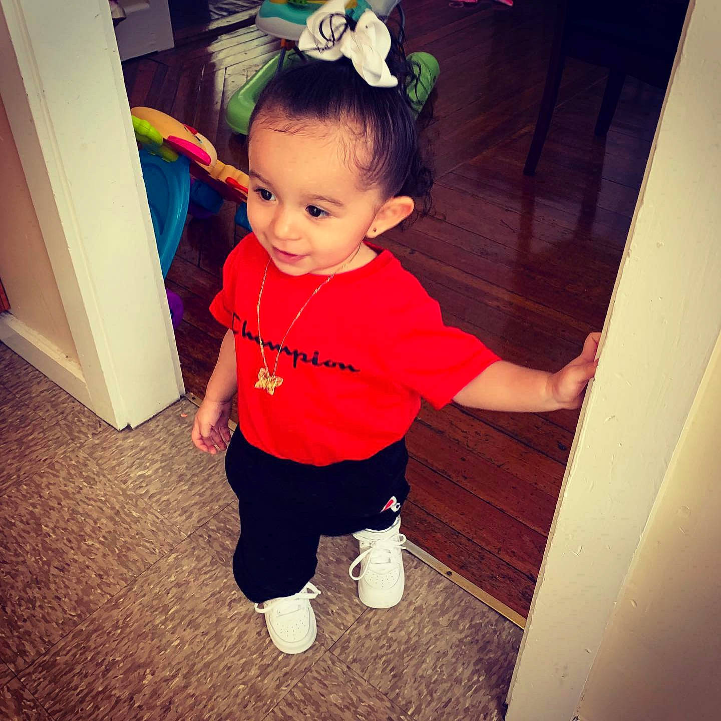 Leela is registered to the contest to win money with this photo: arm, baby, baby_toddler_clothing, cheek, child, cool, eye, face, happy, head, human, leg, outerwear, person, play, shoe, skin, smile, standing, t_shirt