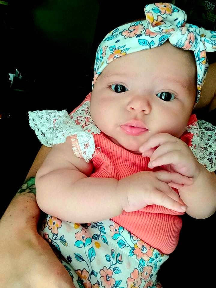 Oakley is registered to the contest to win money with this photo: baby, baby_toddler_clothing, blue, cap, cheek, eyelash, facial_expression, finger, green, hand, happy, headgear, headwear, iris, lip, person, pink, purple, skin, sleeve